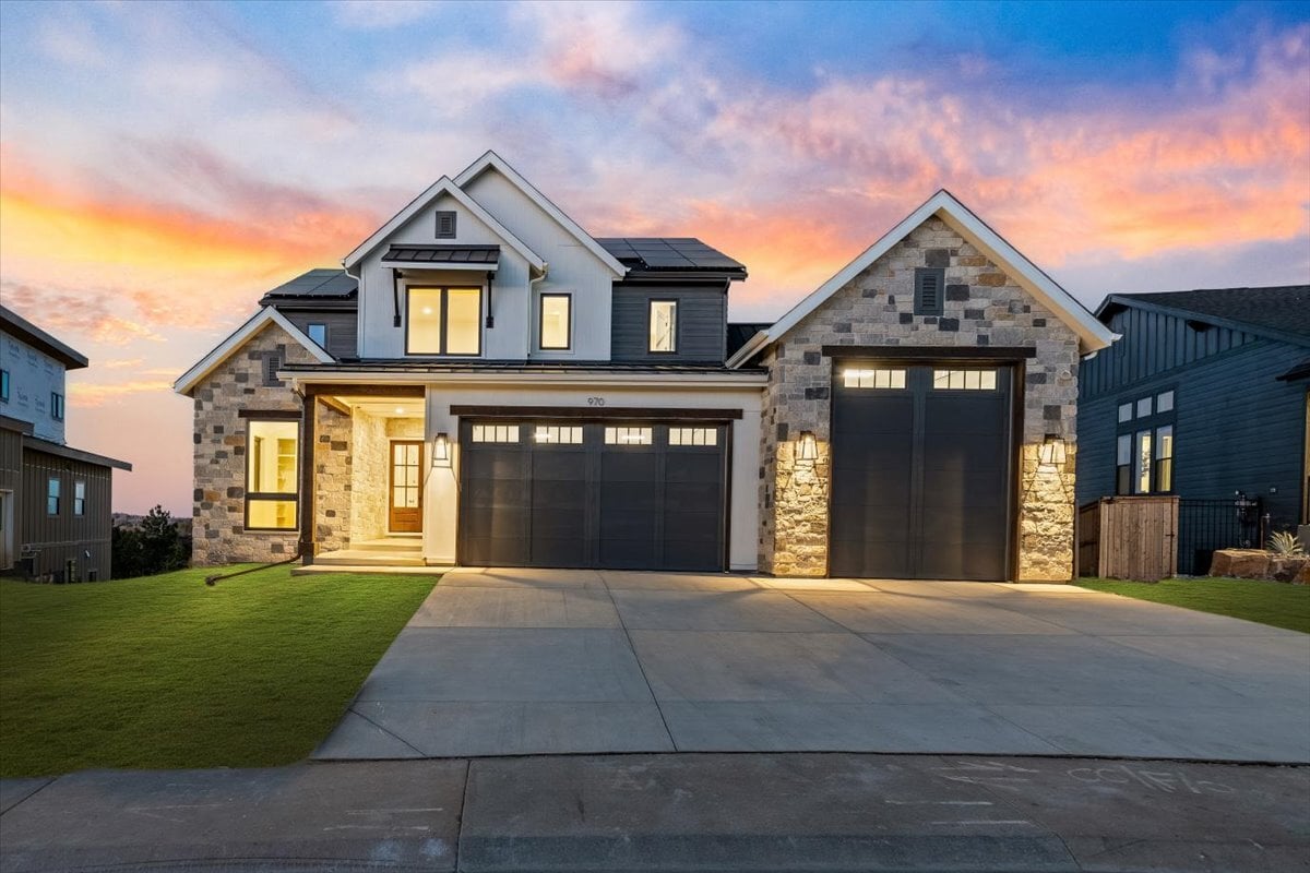 exterior two-story custom home at twilight
