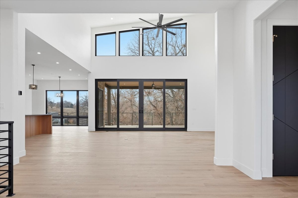 Plan 4977 great room with floor-to-ceiling windows