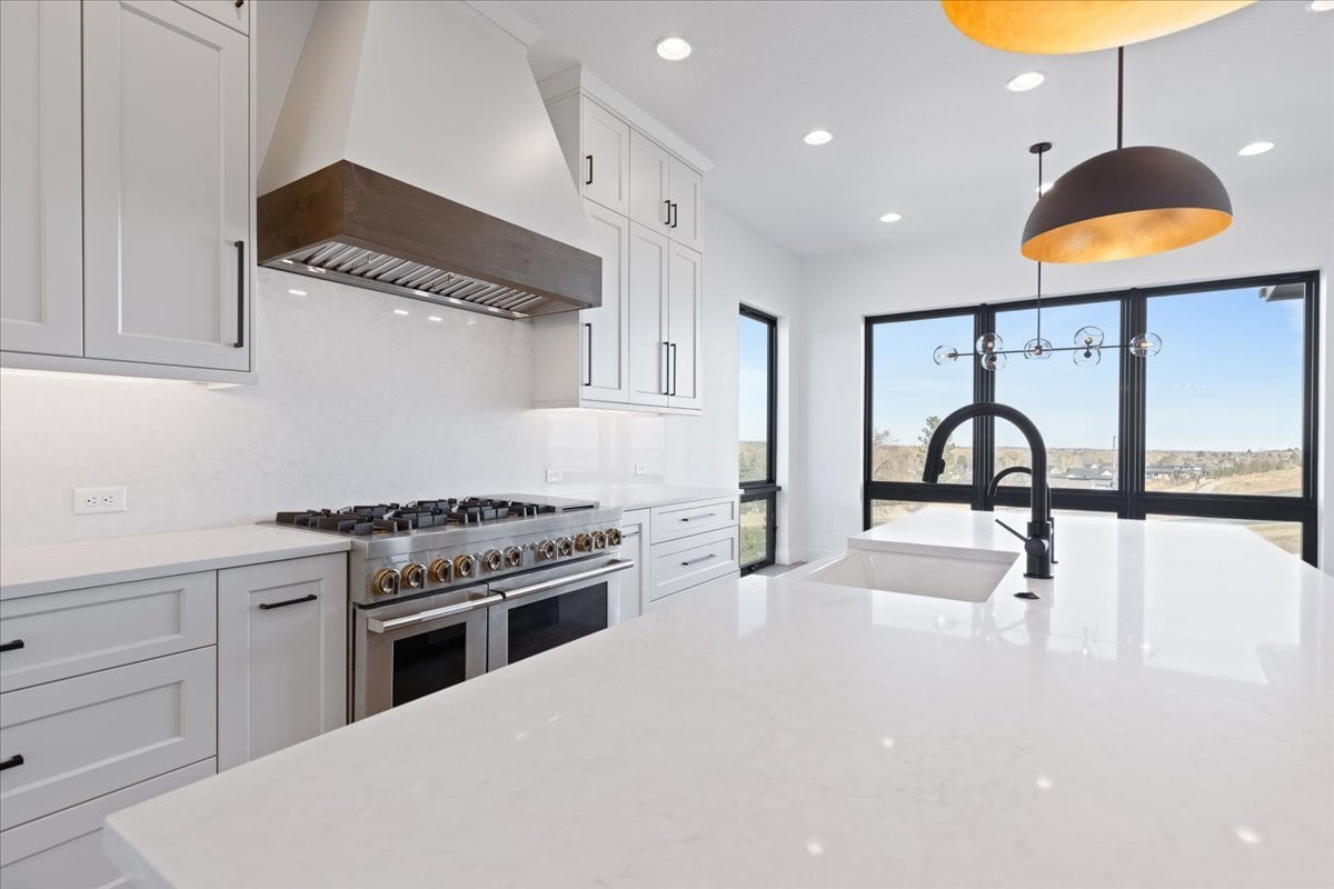 luxury kitchen with custom hood and range top