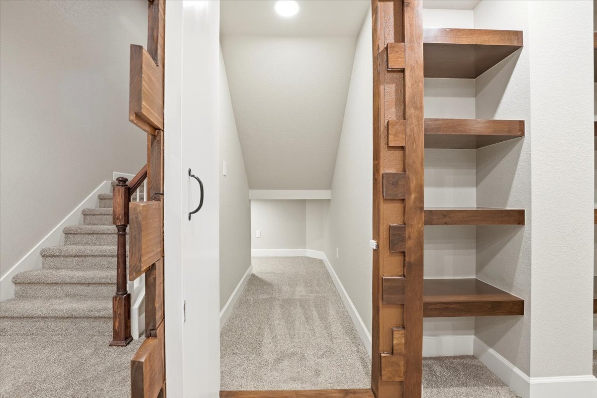 closeup of hidden door to under-stair storage