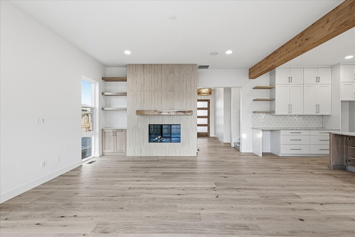 Plan 3929 great room with fireplace and ceiling beam