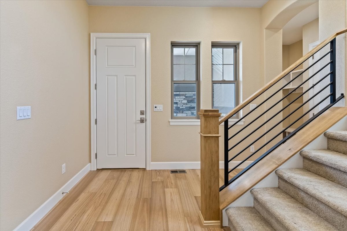 home entrance with hardwood floor