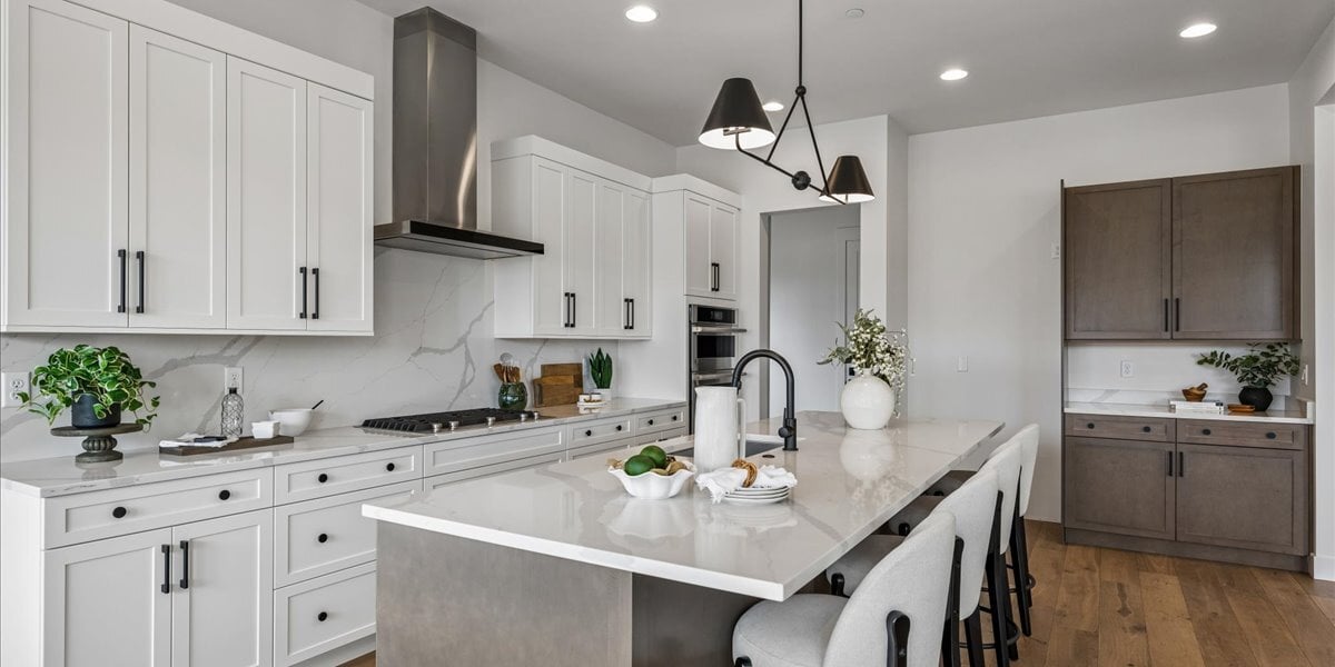 kitchen island, cabinets, and range hood