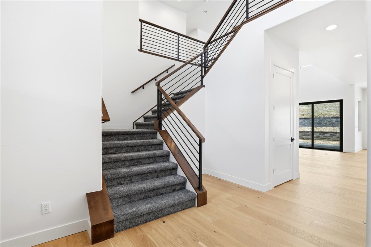 Plan 3461 carpeted staircase with open handrail