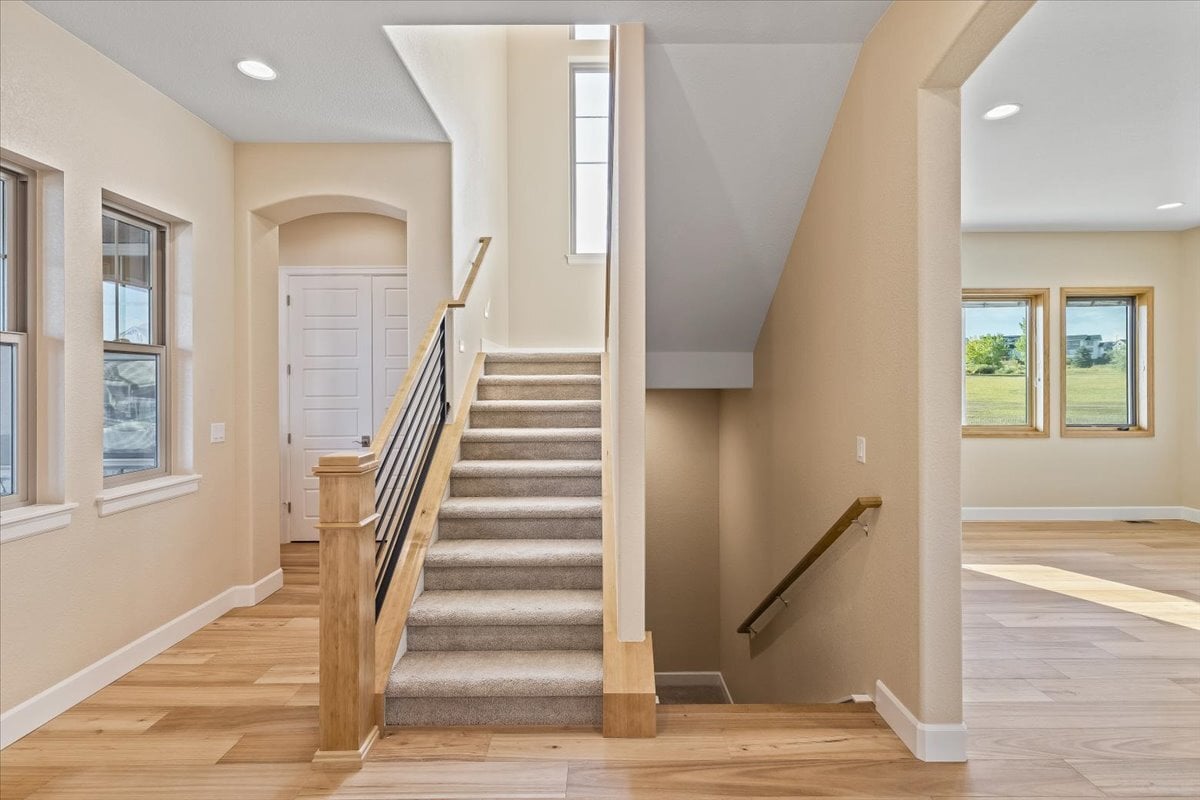 foyer of home with view of staircases going up and down
