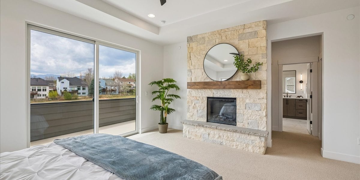 stone fireplace in primary suite