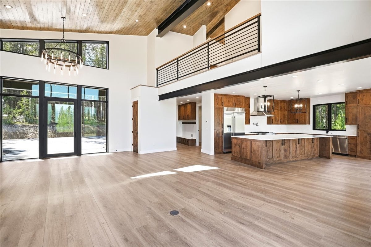 Fraser custom home - great room with vaulted ceiling and view to loft