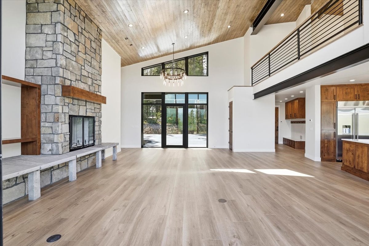 Fraser custom home - great room with stone fireplace and built-ins