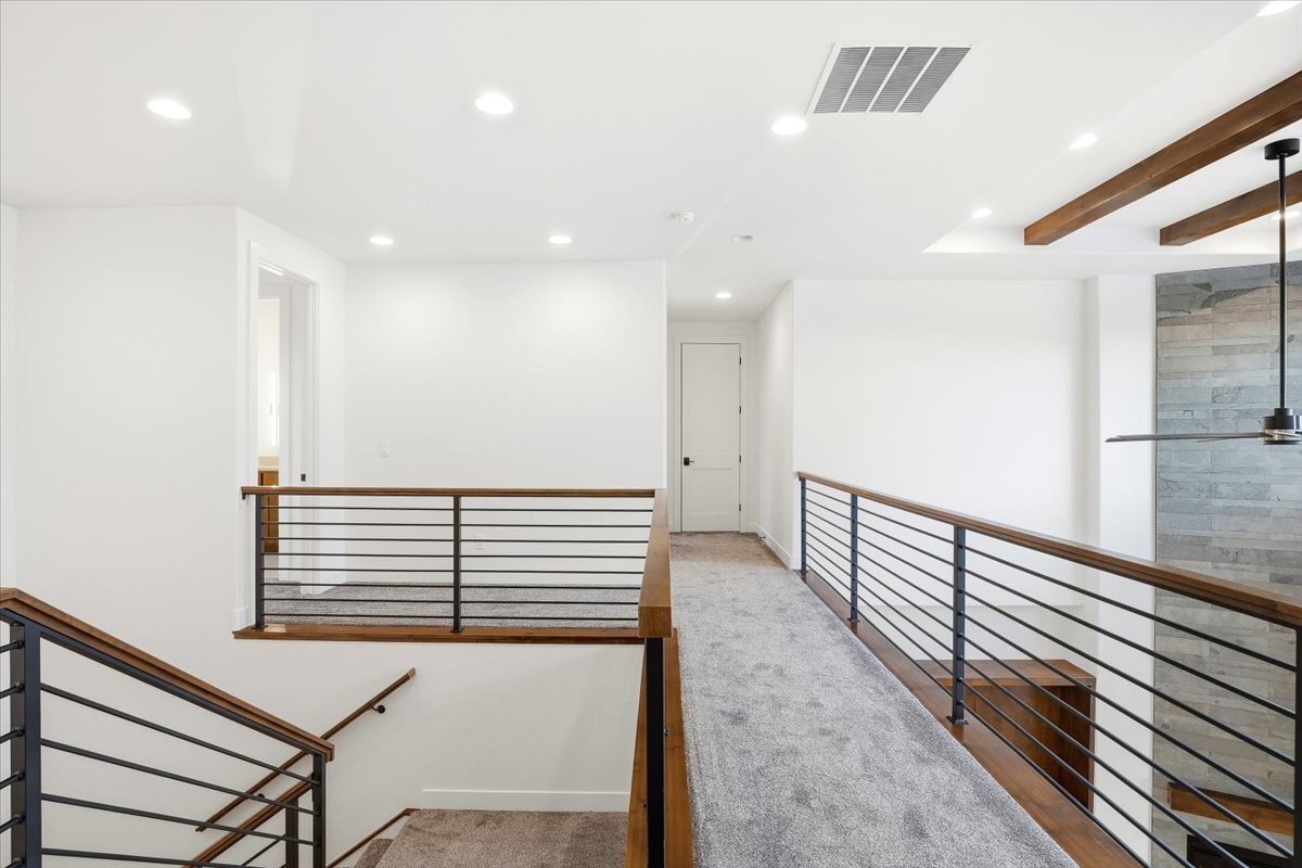 Plan 3461 second floor walkway with open handrail