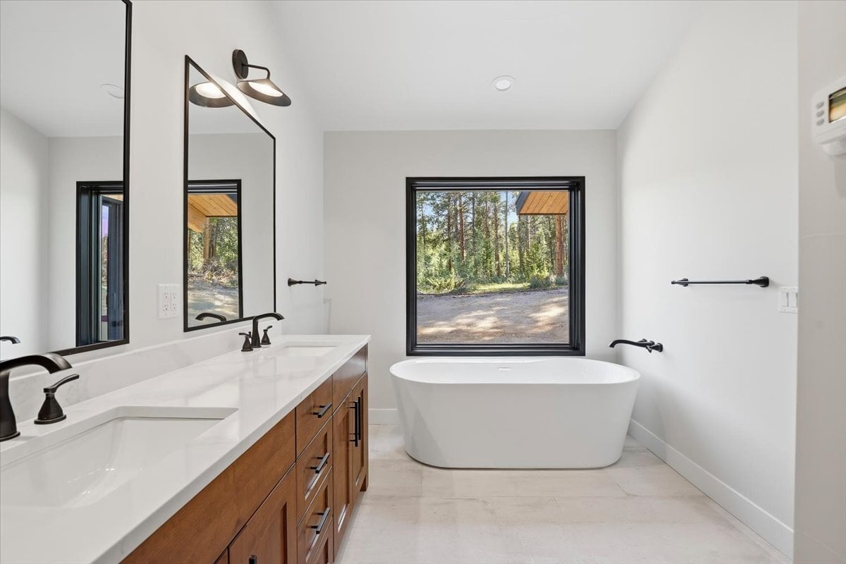 Fraser custom home - primary bath with soaker tub and picture window