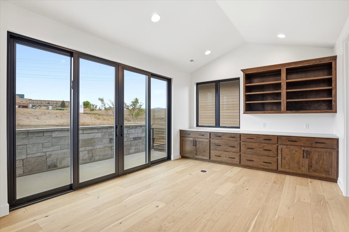 Plan 3461 second floor office with sliding doors to deck and built-ins