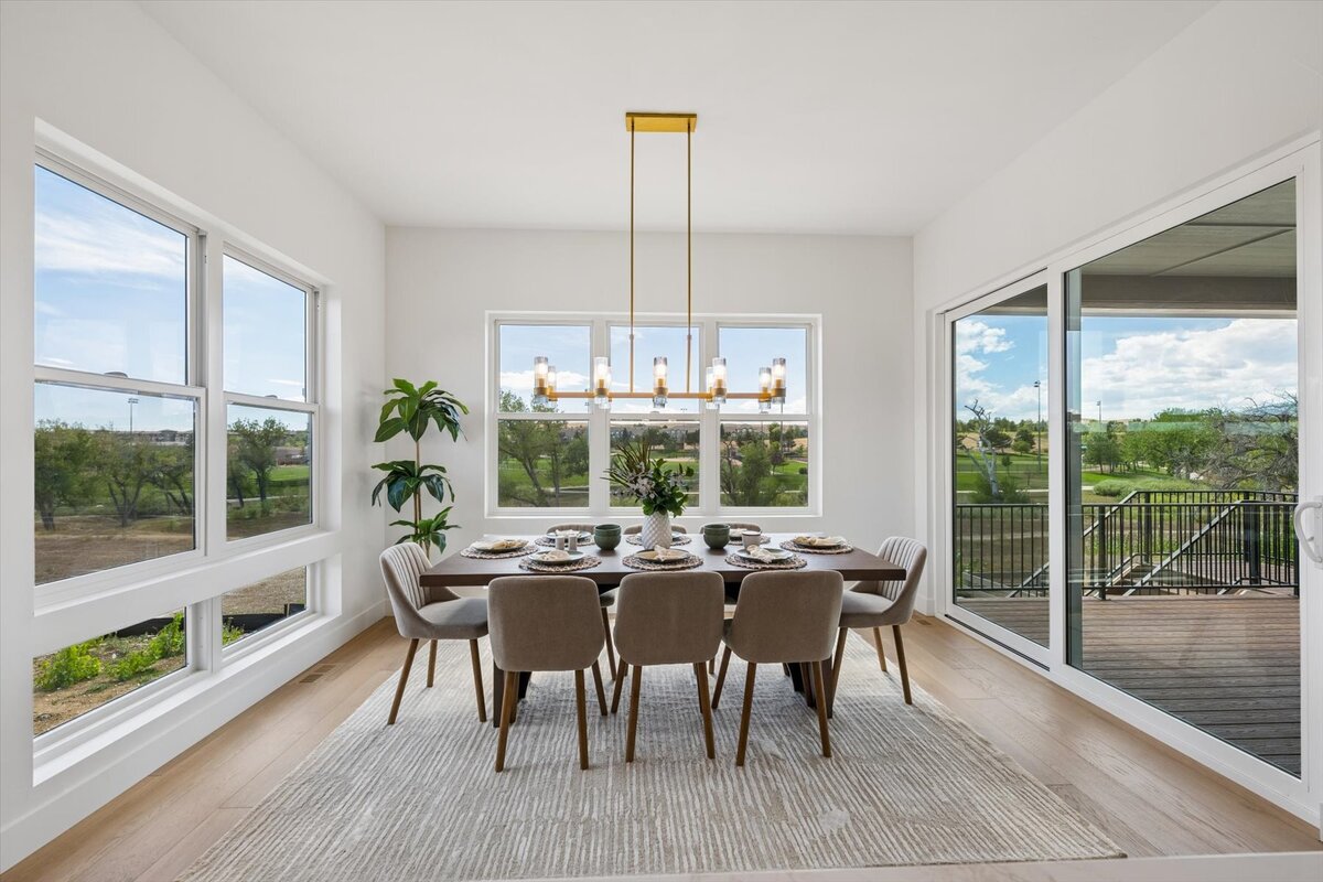 Sheffield Plan 3481-dining area surrounded by windows and walk-out patio