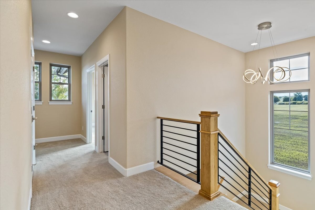 upstairs landing and hallway with stylish ceiling fixture