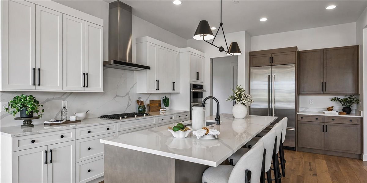 kitchen with island and two-tone cabinetry