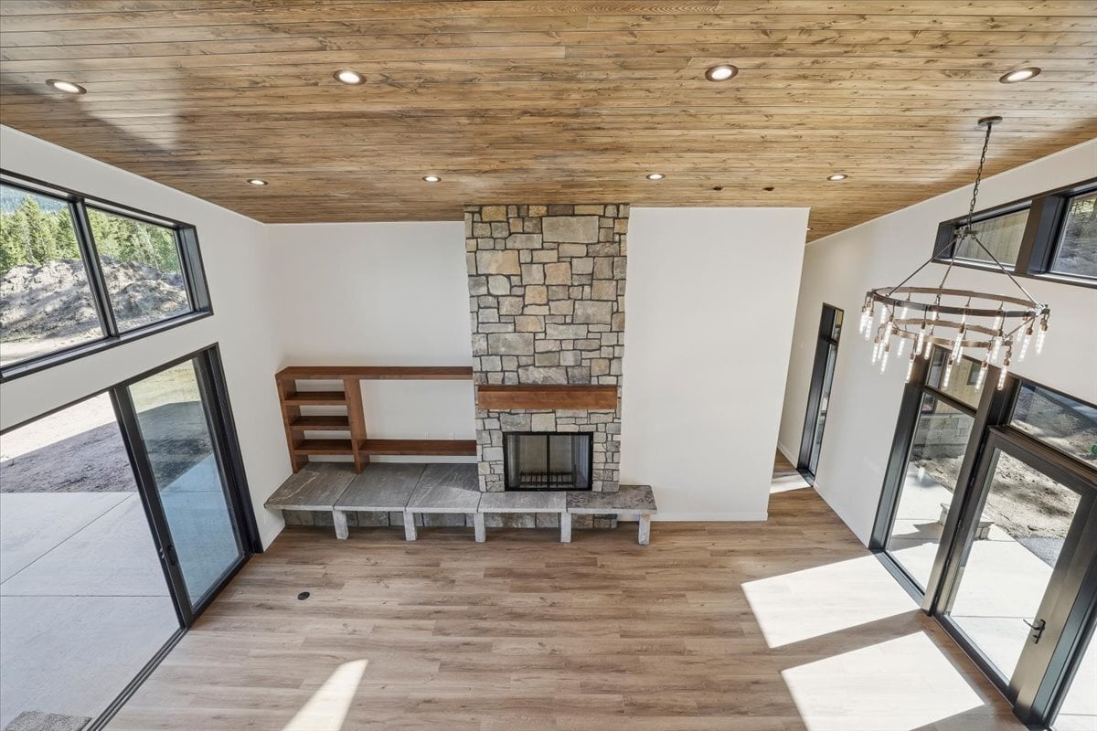 Fraser custom home - view into great room from upstairs loft hallway