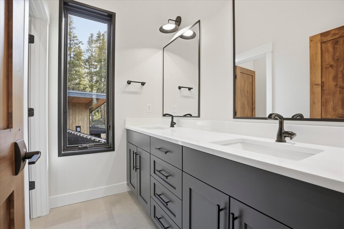 Fraser custom home - Secondary bathroom with double vanity and painted cabinetry