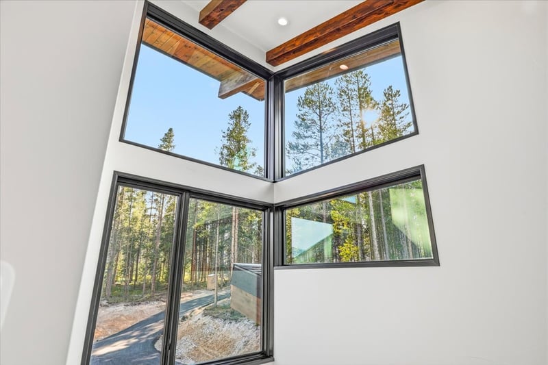 corner interior windows with mountain views