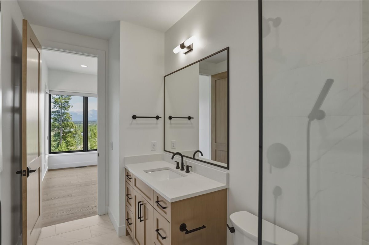 secondary bath with view into attached secondary bedroom