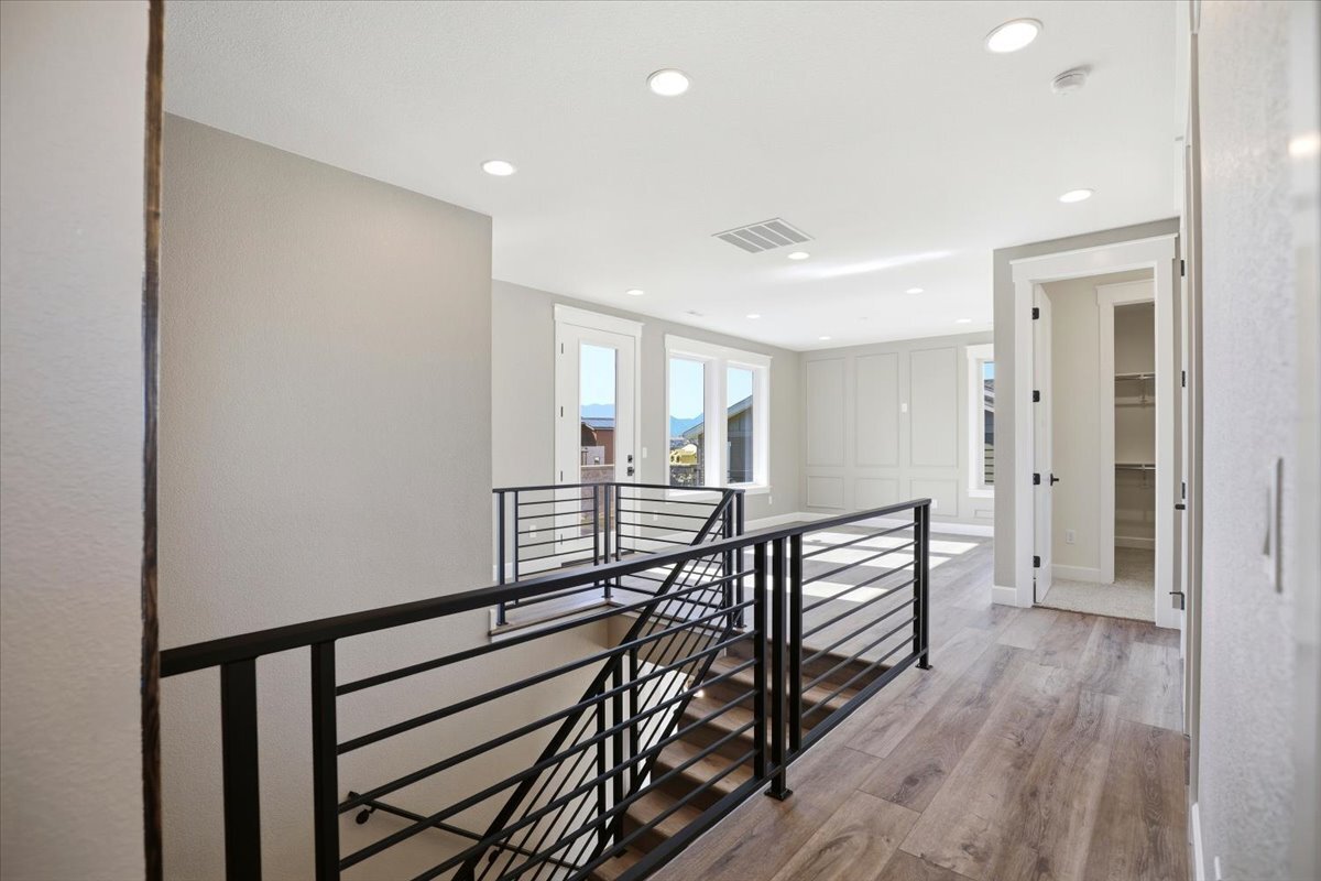 Plan #3964 - view from upstairs hallway to paneled loft area