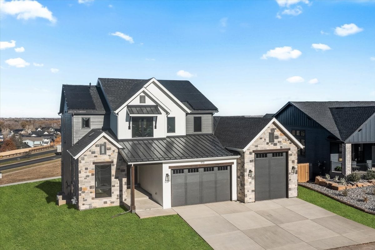 exterior daytime drone view of home