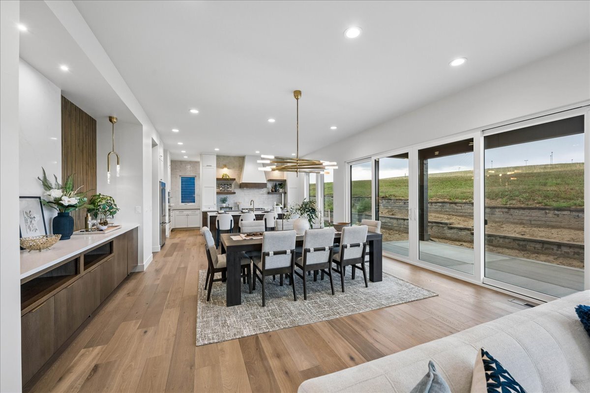 view of dining room from great room, showing wall of windows with unobstructed views