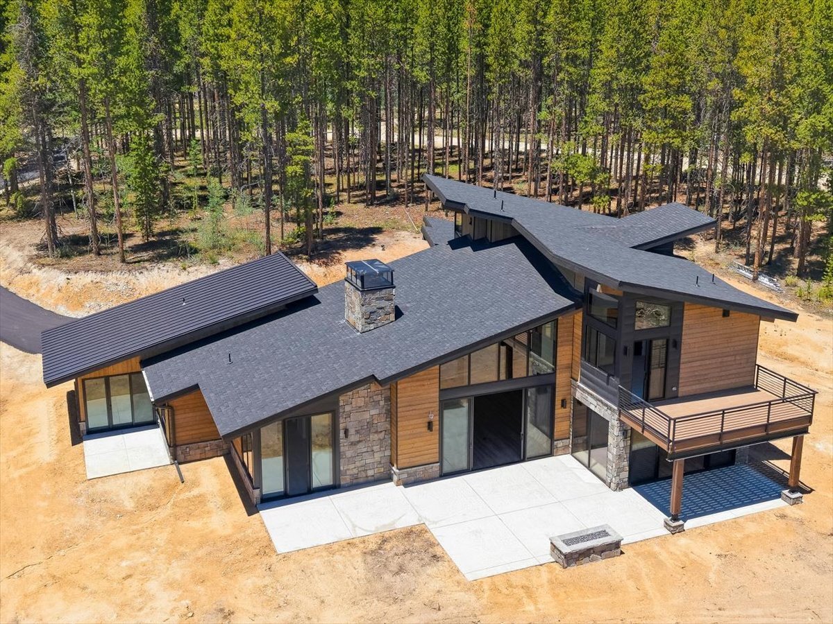 Fraser custom home - exterior drone view from rear