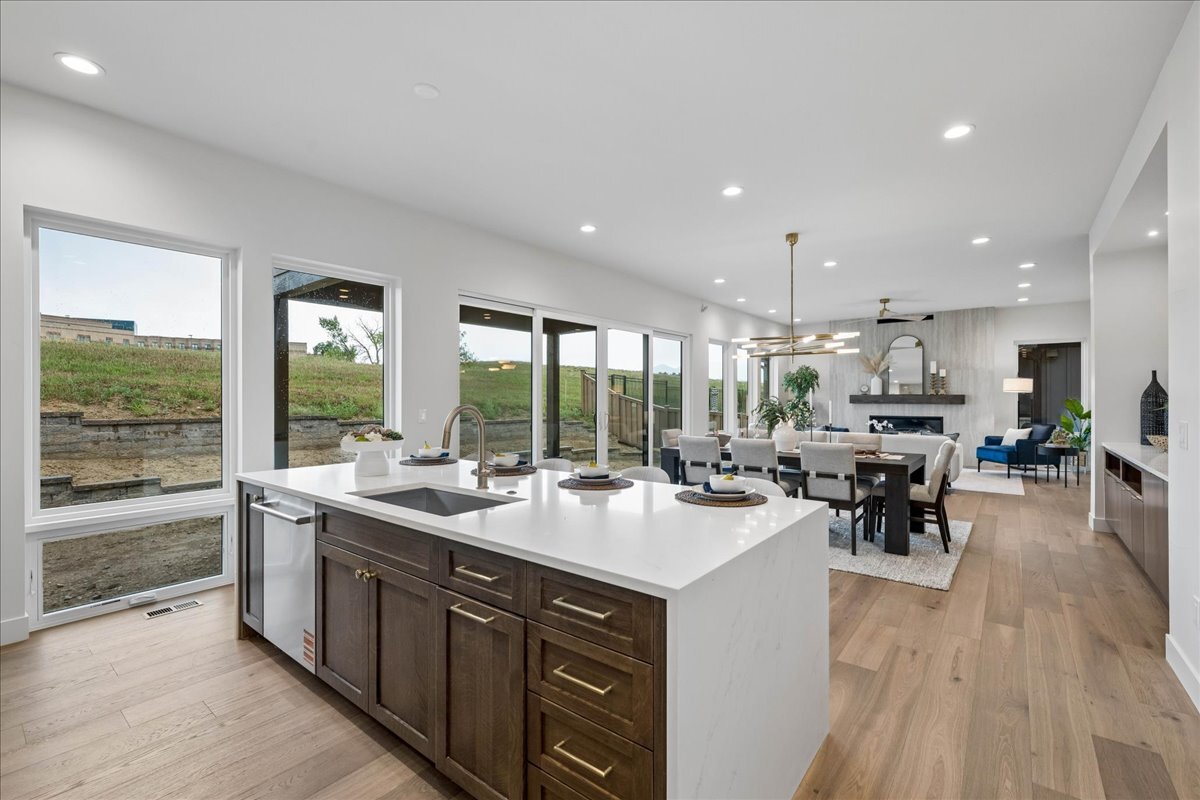back side of kitchen island showing wall of windows with unobstructed views