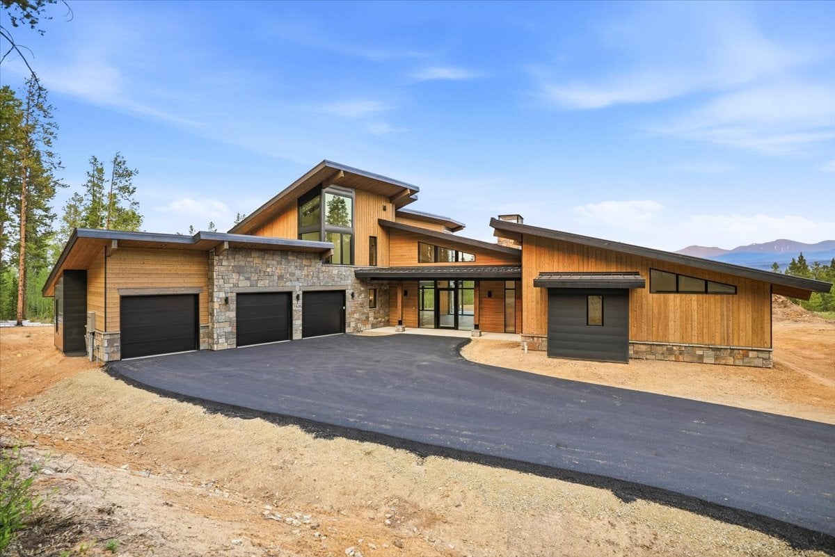 Fraser custom home - exterior front showing asphalt driveway