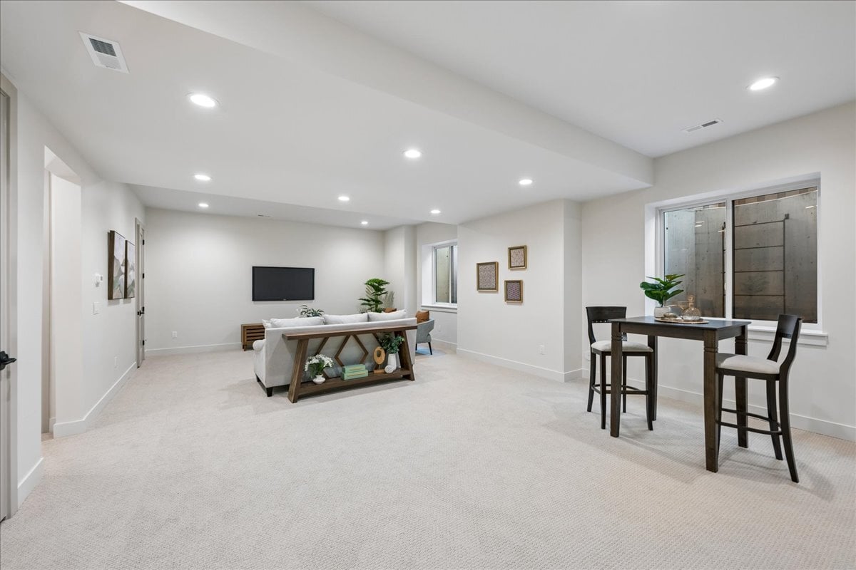 finished basement with entertainment and game areas