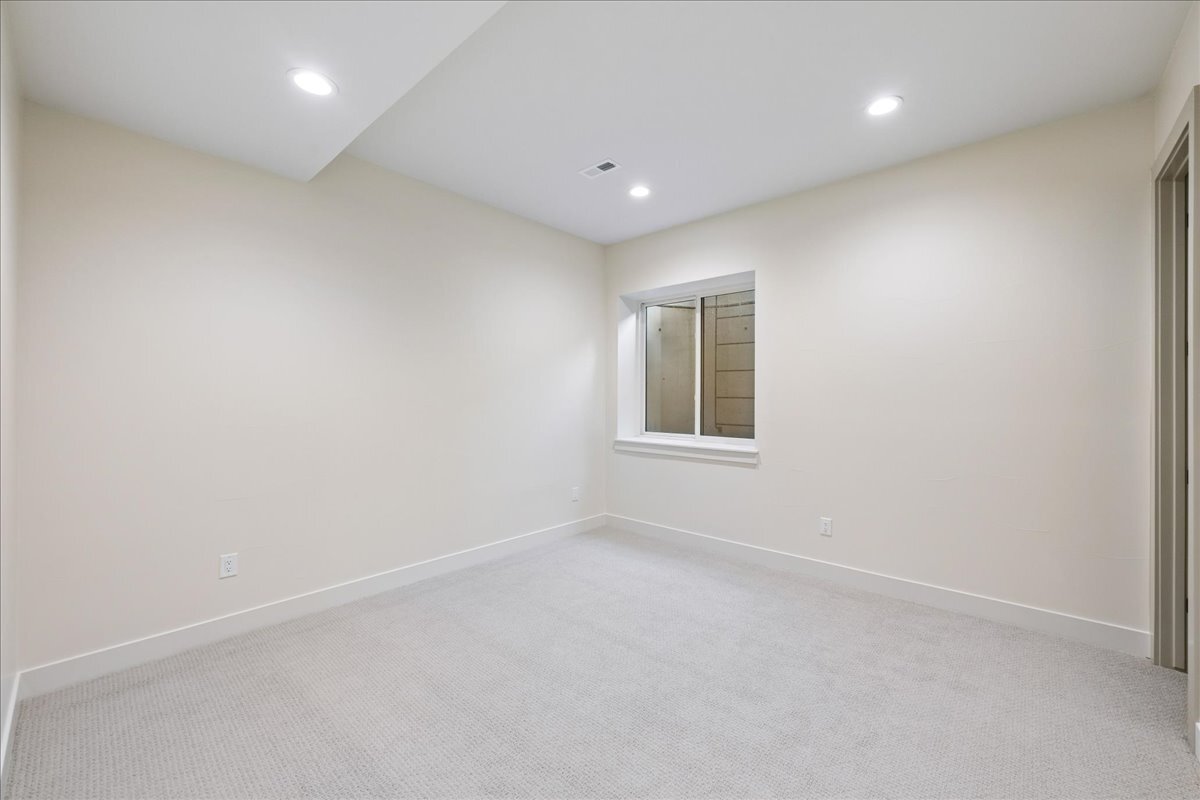 bedroom in finished basement, with egress window access