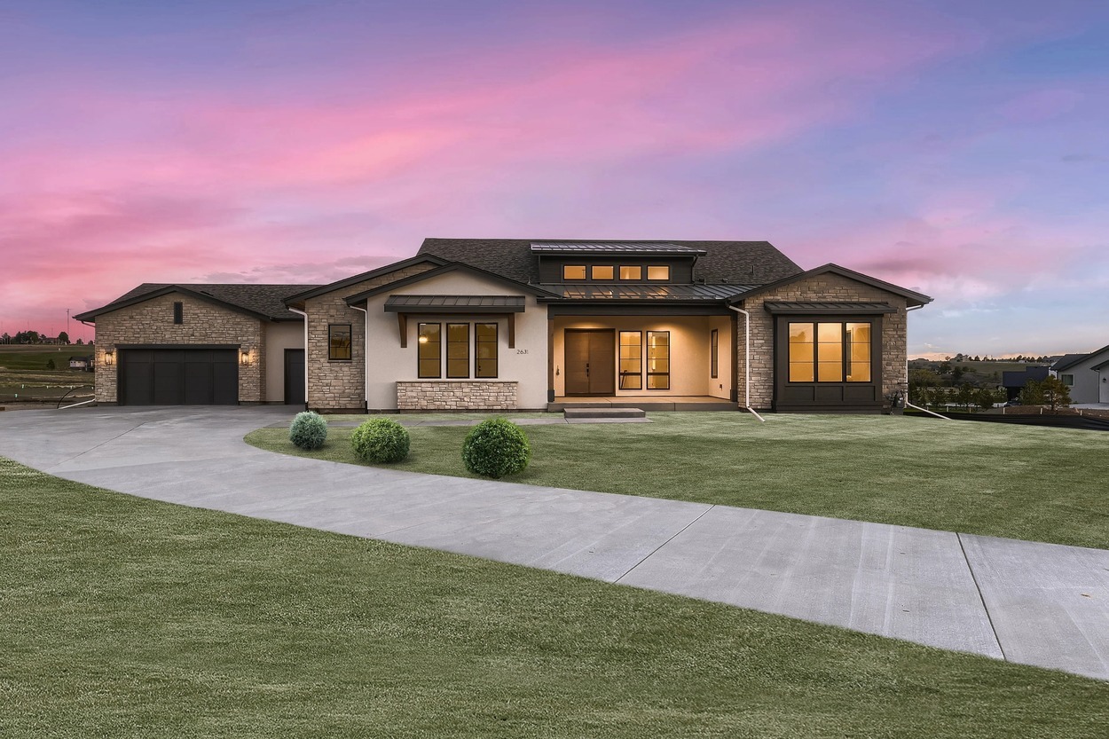 Exterior front of custom home at sunset by Sheffield Homes in Denver, CO