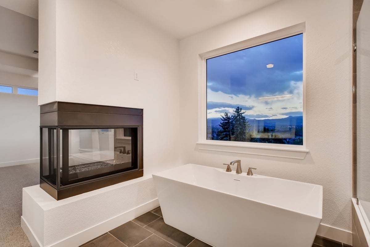 Custom bathroom with a large window and tub in a Sheffield Homes build, Arvada, CO