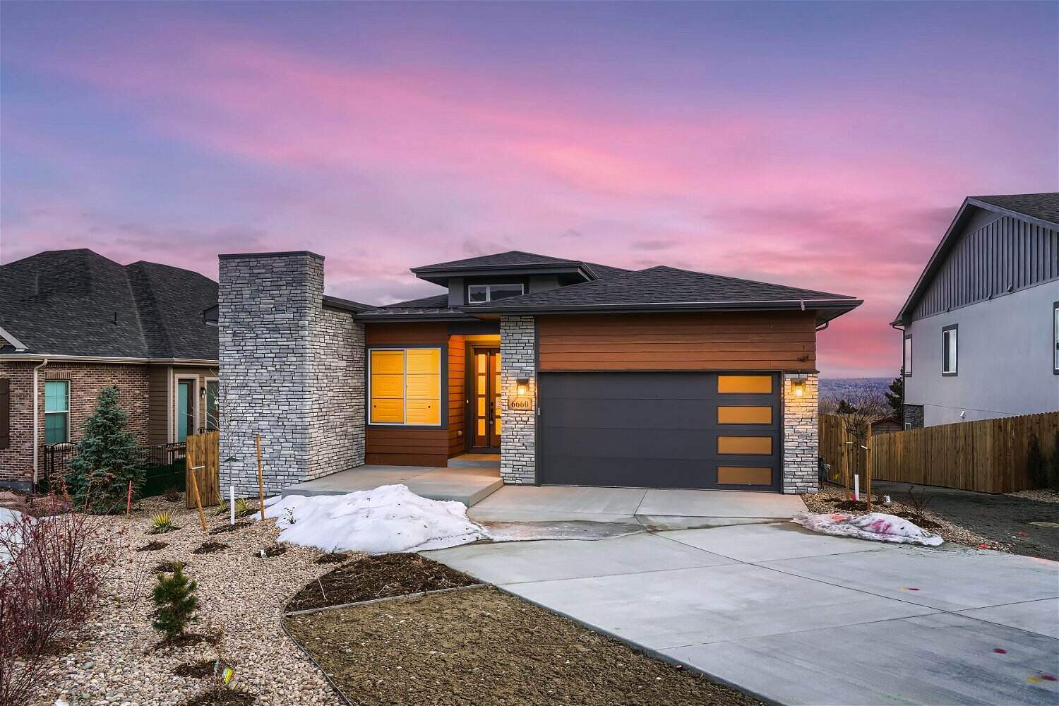 Front exterior view of a spacious, elegant house constructed by Sheffield Homes in Arvada, CO