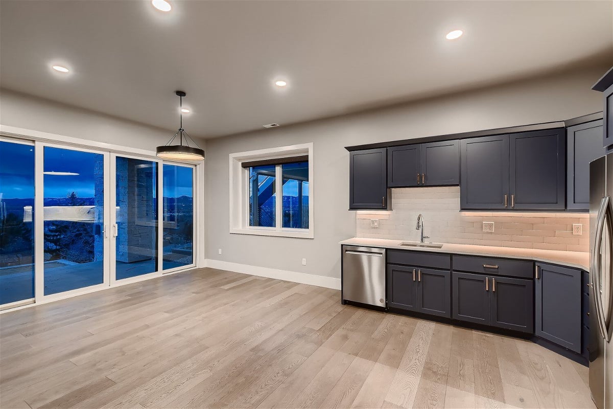 Lower level kitchenette with dark cabinets in Sheffield Homes custom home, Denver, CO