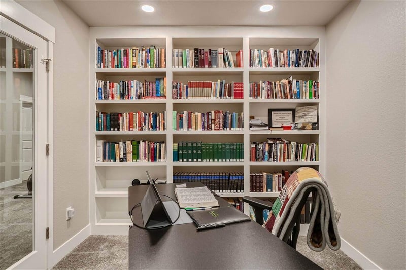 Home office with built-in bookcases in finished basement by Sheffield Homes in Denver, CO