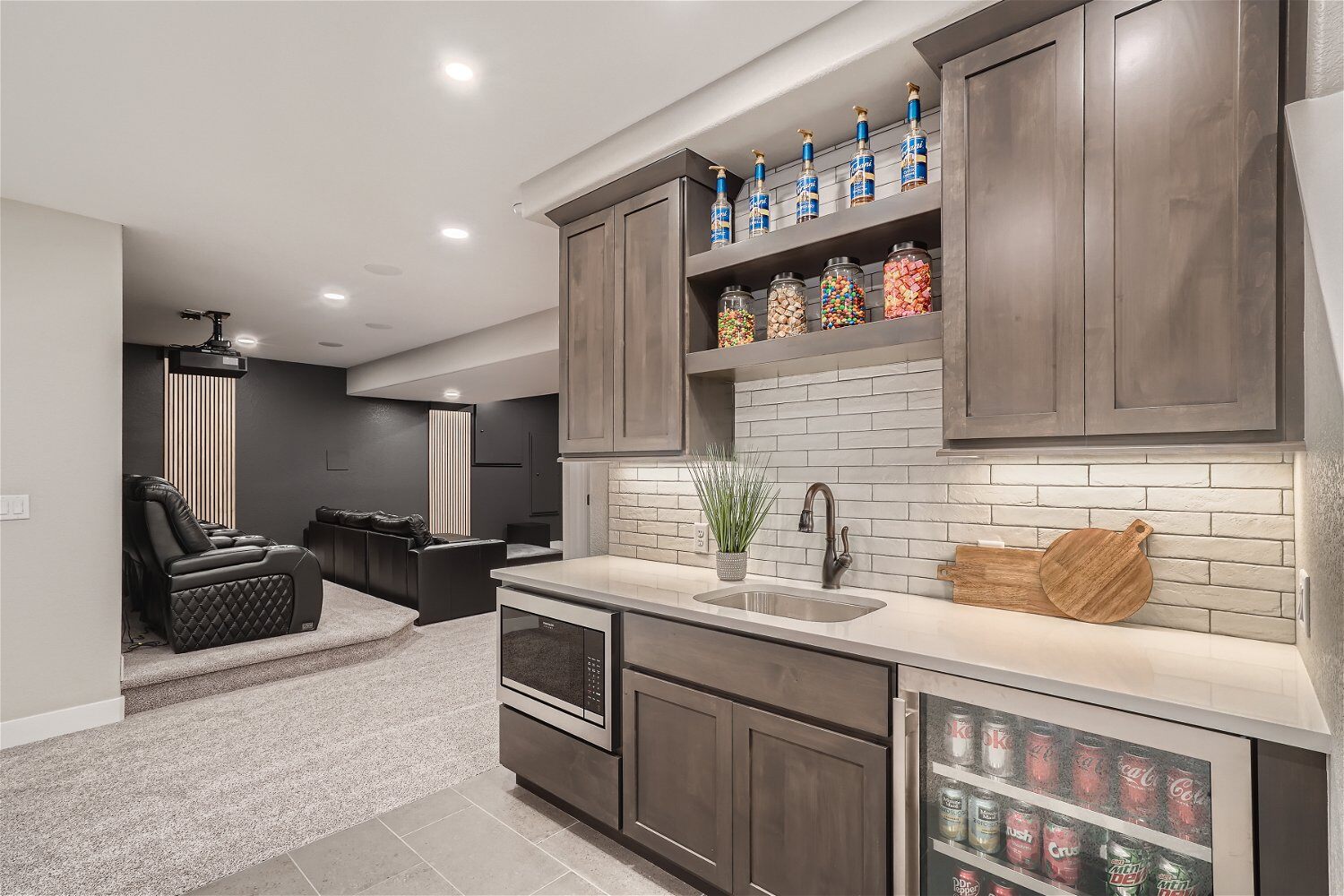 Finished basement wet bar and entertainment area by Sheffield Homes
