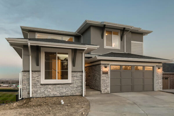 Another version of our reverse walk-out plan, this month’s featured home proffers a generous 3,617 finished square feet of well-designed living space. With an impressive yet understated exterior, this plan (#1-B in our Gage Hill series) offers the flexibility of 3 – 6 bedrooms and 3 - 4 baths.