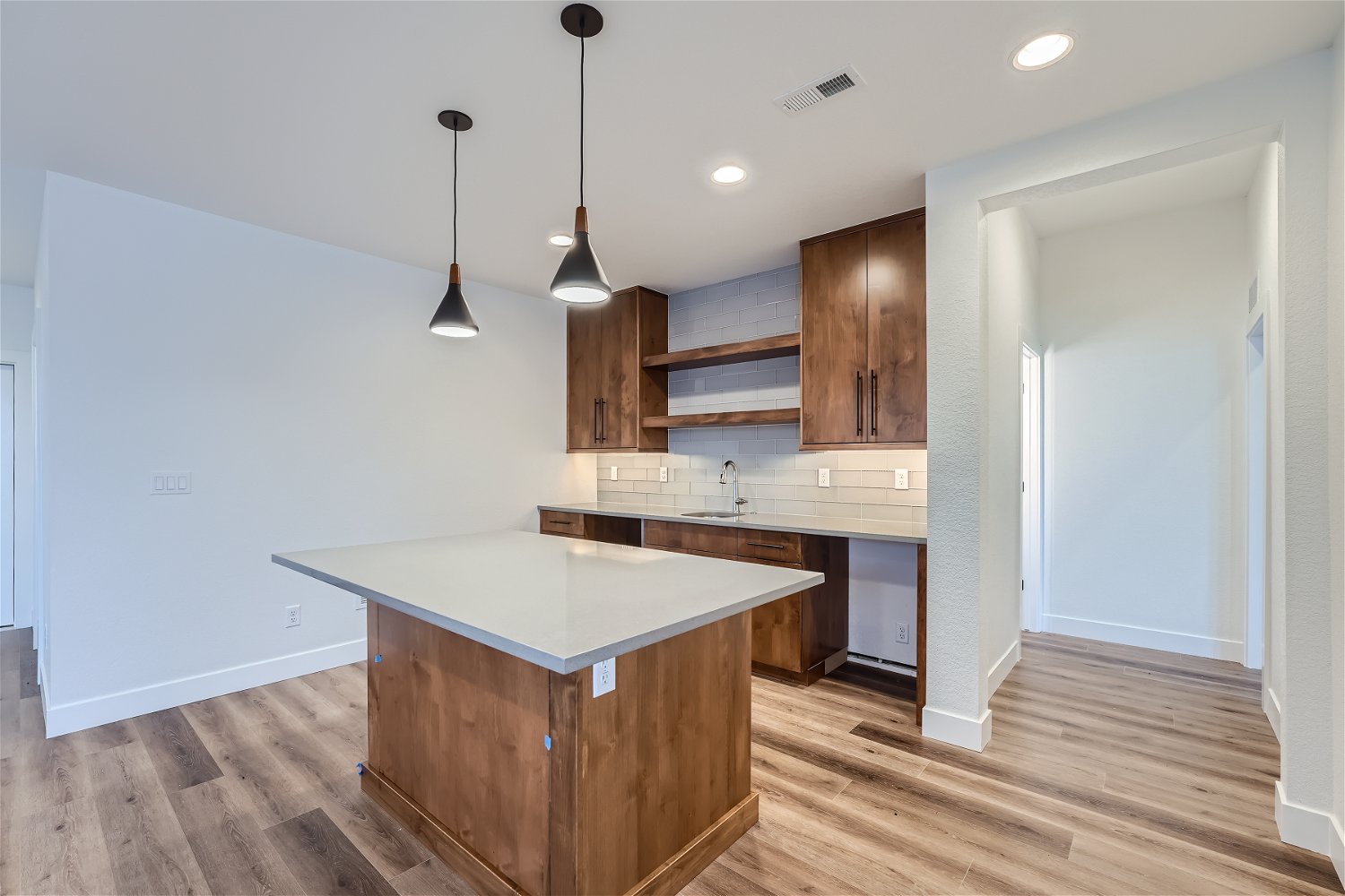 Finished basement wet bar with island