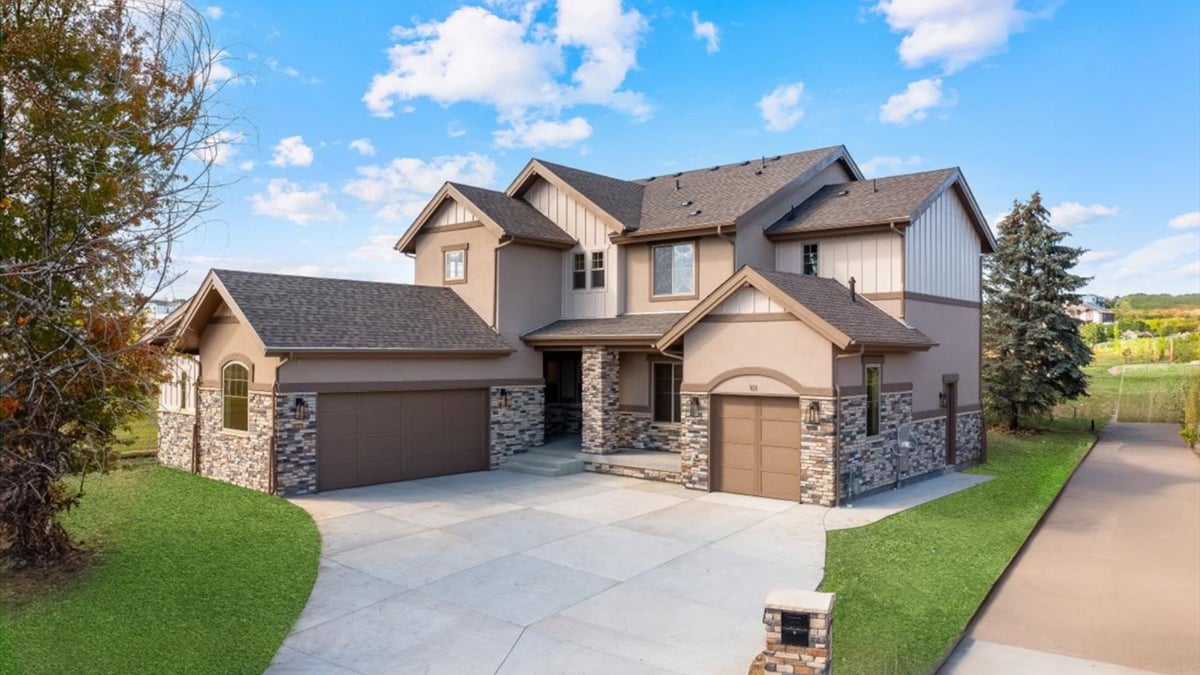 exterior of a two-story brick and siding home