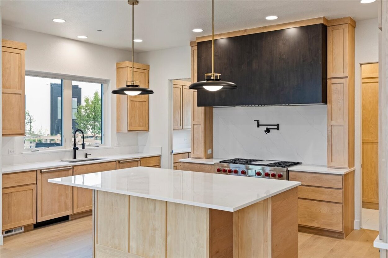 High-end appliances and custom cabinetry in this Denver, CO luxury custom home kitchen High-end appliances and custom cabinetry in this Denver, CO luxury custom home kitchen