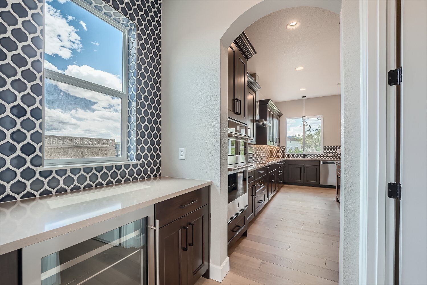 Butler_s pantry with a custom wall design and storage space next to the kitchen in a Sheffield Homes home in Superior, CO(1)