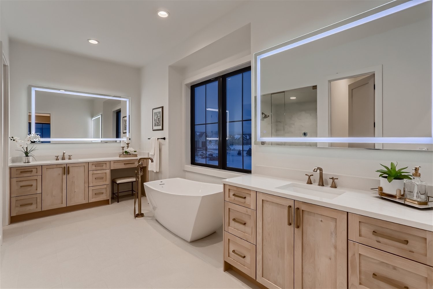 Luxurious primary bathroom with dual vanities in a custom home at 2791 Morning Run Court, Franktown, CO