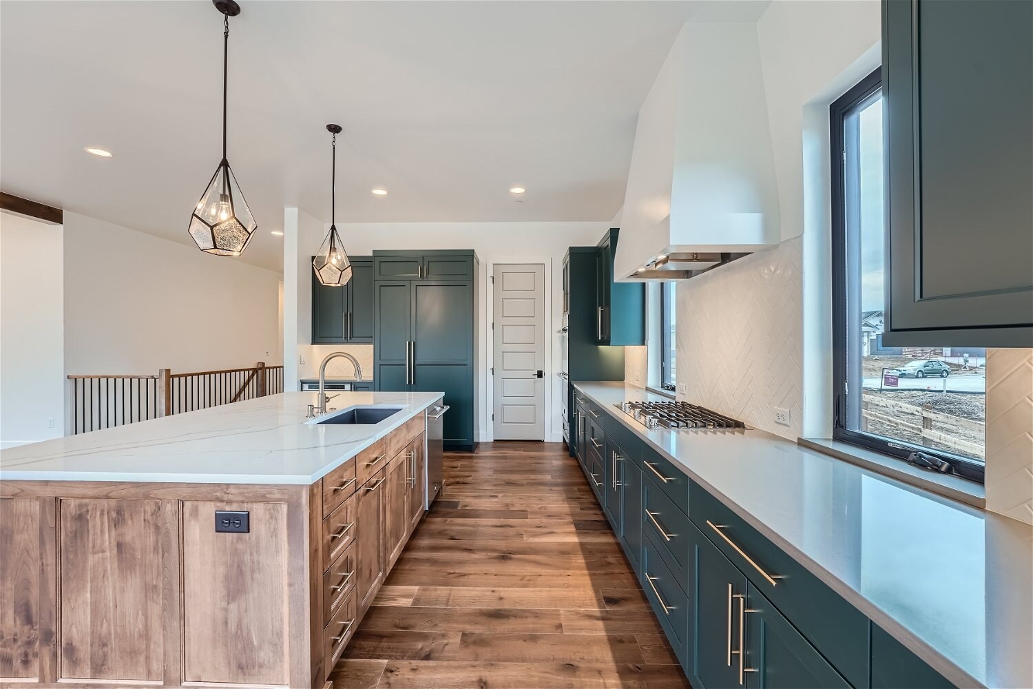 Modern kitchen with contrasting cabinetry in a custom home project